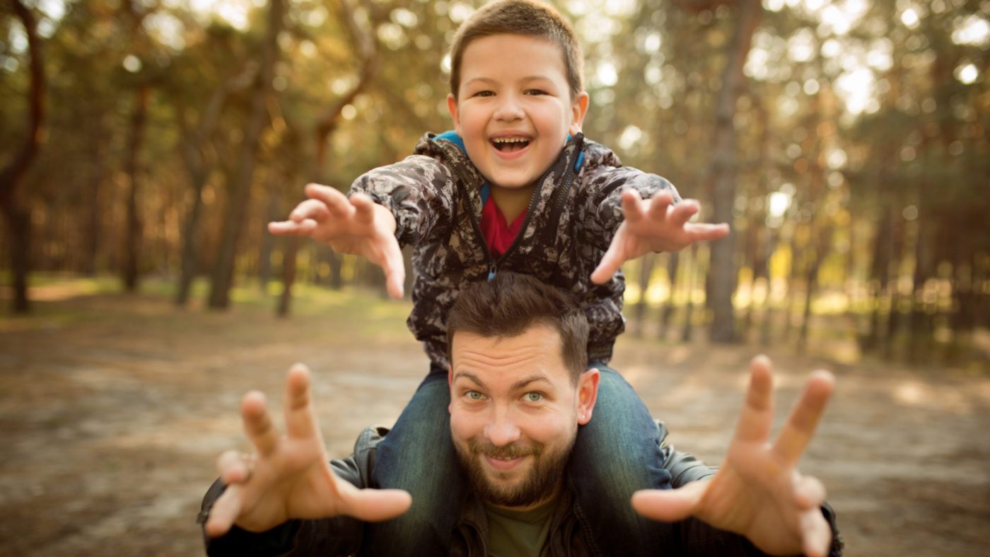 Father and son walking and having fun in autumn forest, look happy and sincere <strong>Skupaj in z njim</strong>: Praznik <EM>Kristusa kralja vesoljstva</EM>